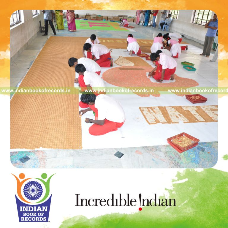 team creating large mosaic using cookies for record in Indian Book of Records