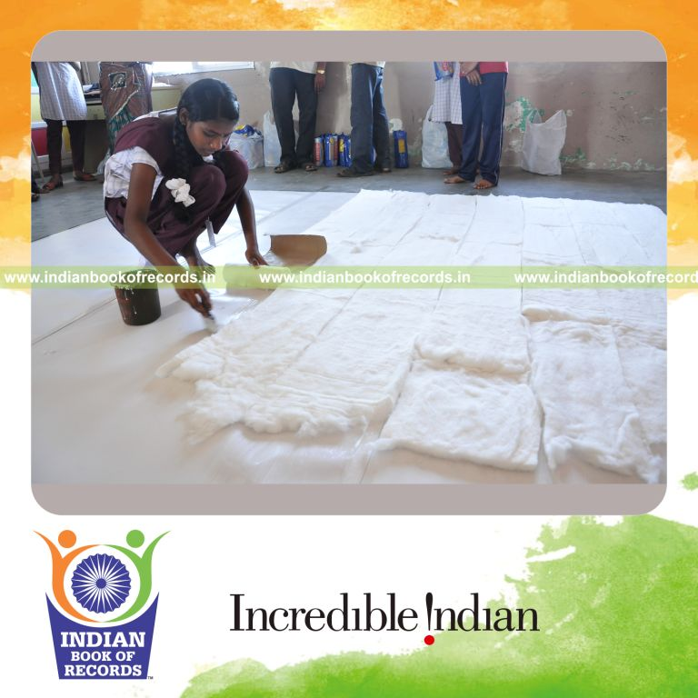 young female creating large mosaic using cotton for record in Indian Book of Records