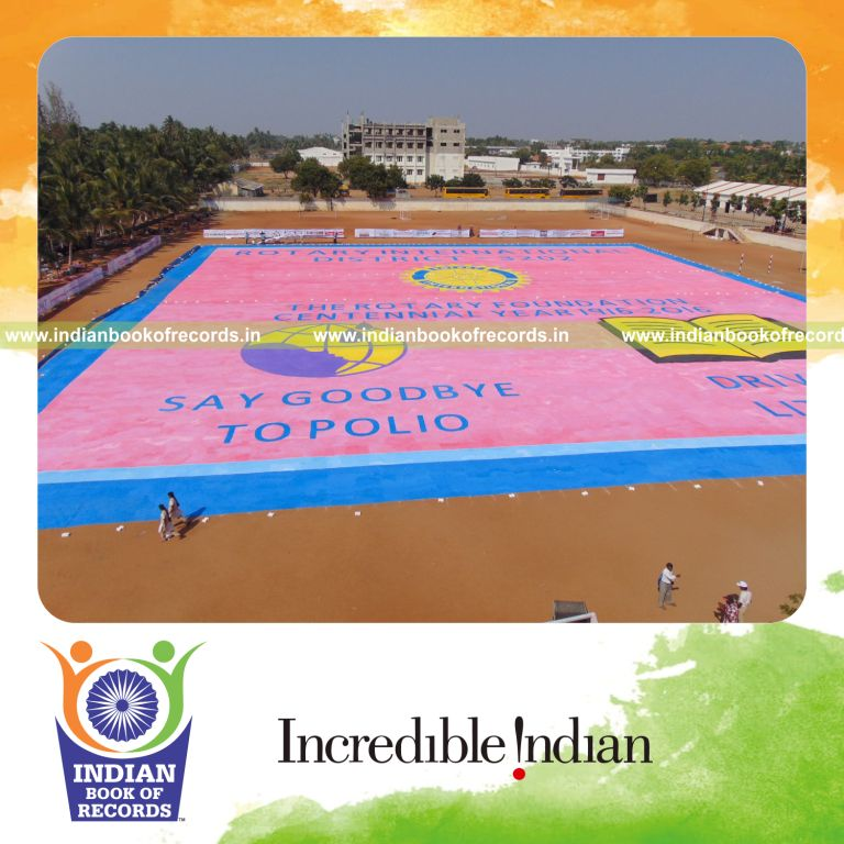 team creating large finger painting artwork for Indian Book of Records