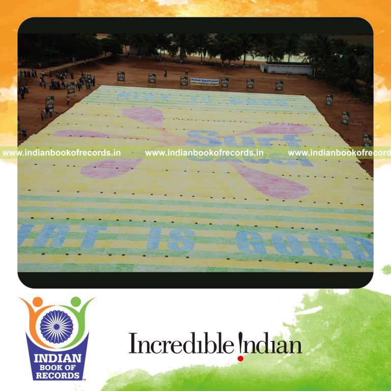 team creating large handprint painting for record in Indian Book of Records