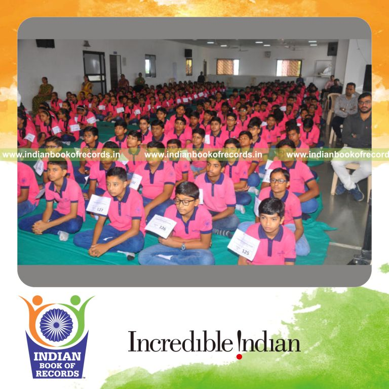 a large group attending a session explaining homeopathy principles and treatment methods for a record in Indian Book of Records