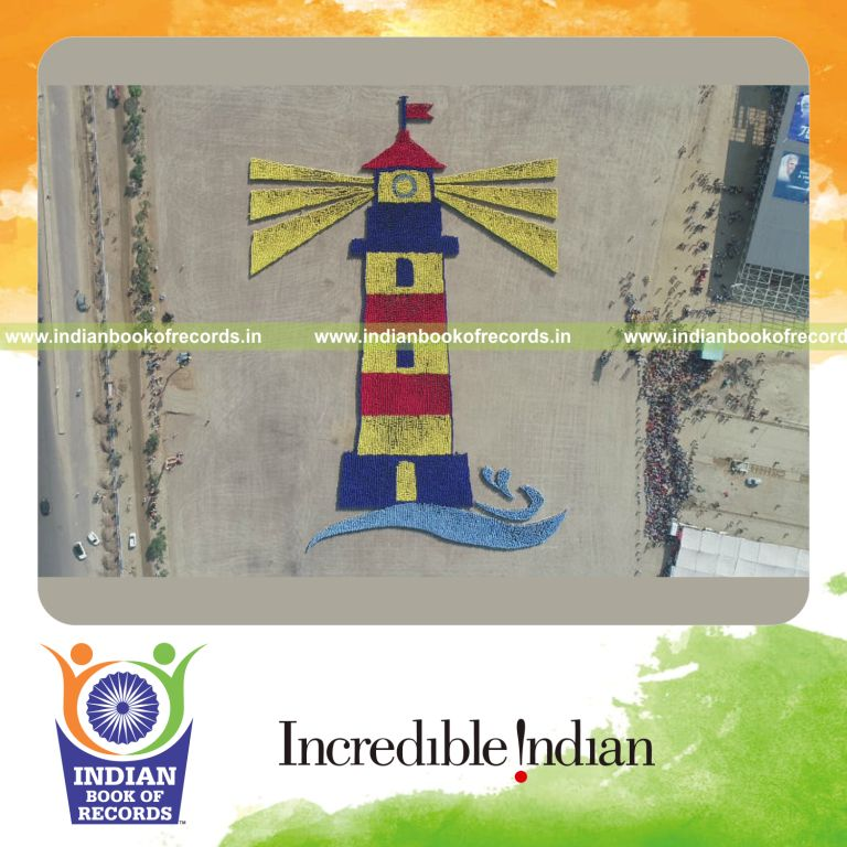 people arranged in a coordinated formation to create the shape of a lighthouse for a record in Indian Book of Records