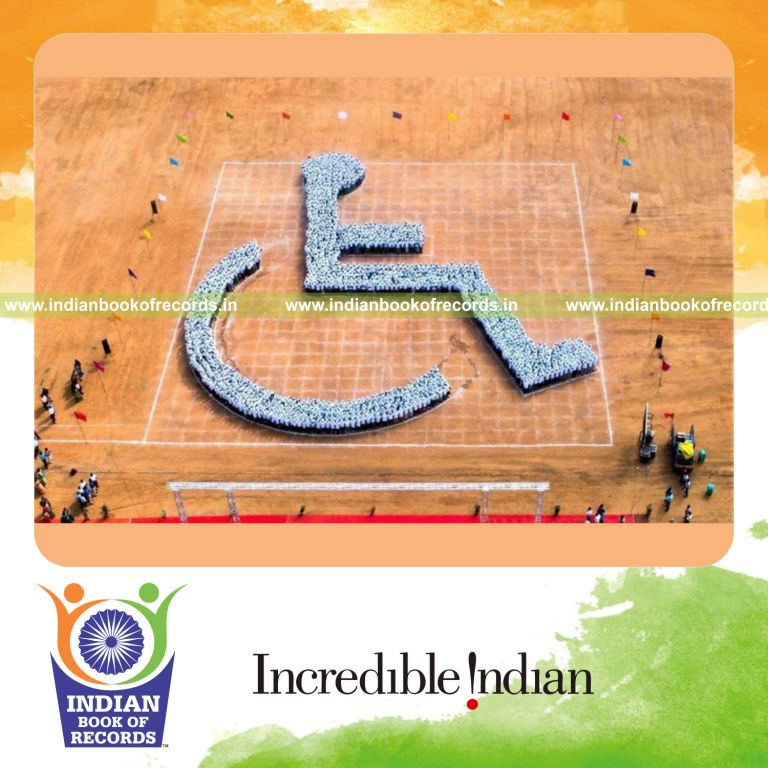 people forming the shape of a wheelchair accessibility symbol in a coordinated arrangement for a record in Indian Book of Records