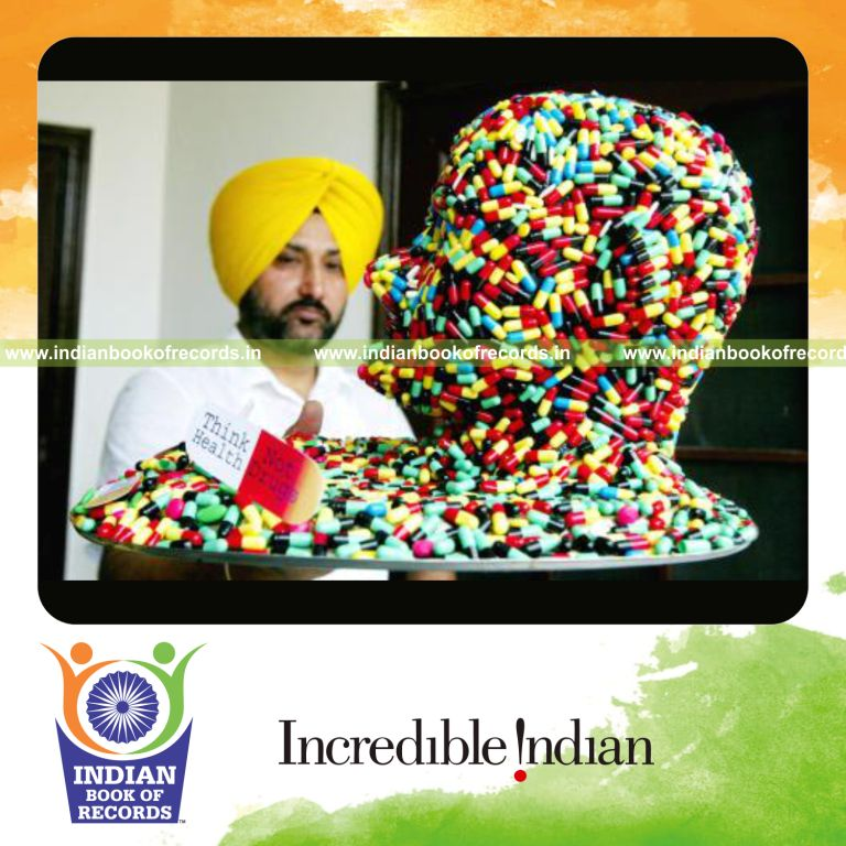 male individual creating human skull model using capsules and tablets for record in Indian Book of Records