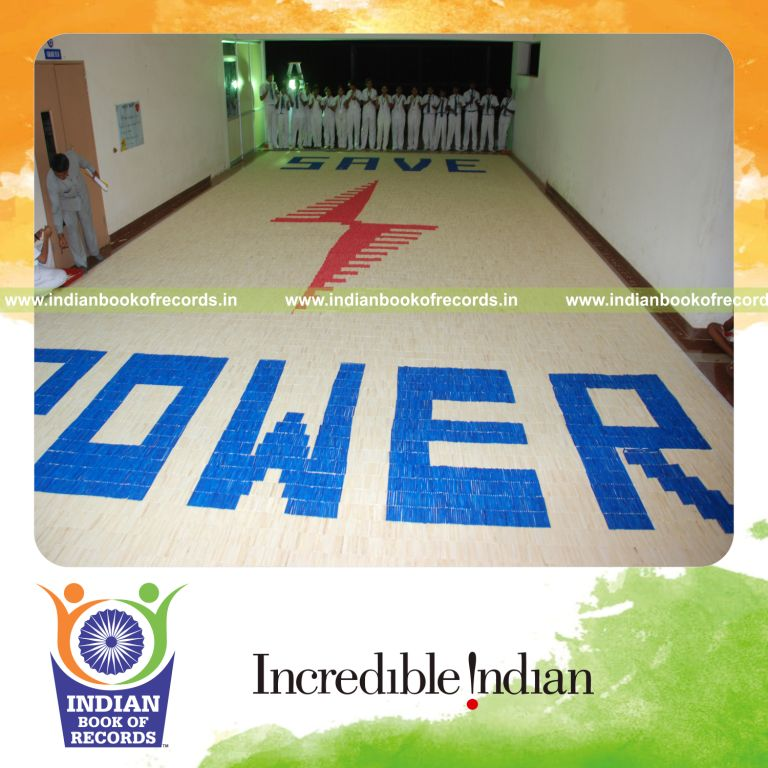 team creating large mosaic using ice sticks for record in Indian Book of Records