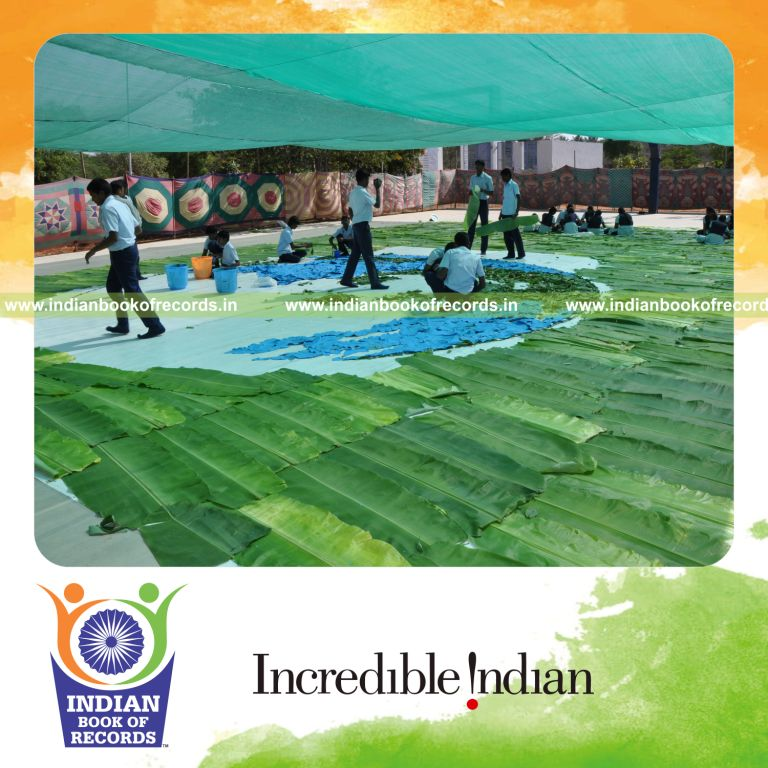 team creating mosaic artwork using leaves for record in Indian Book of Records