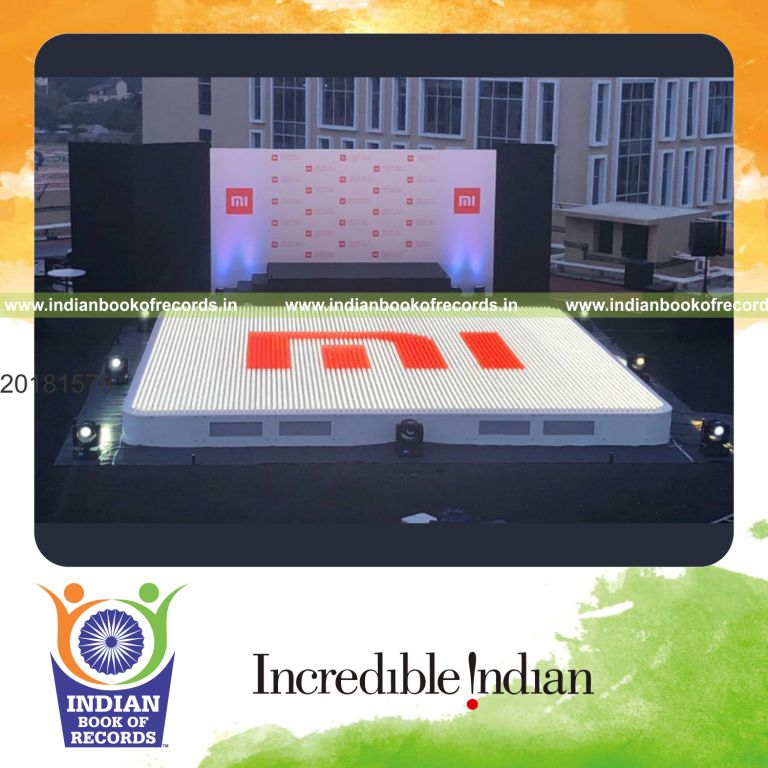 a large logo created using multiple lights arranged in a mosaic pattern for a record in Indian Book of Records