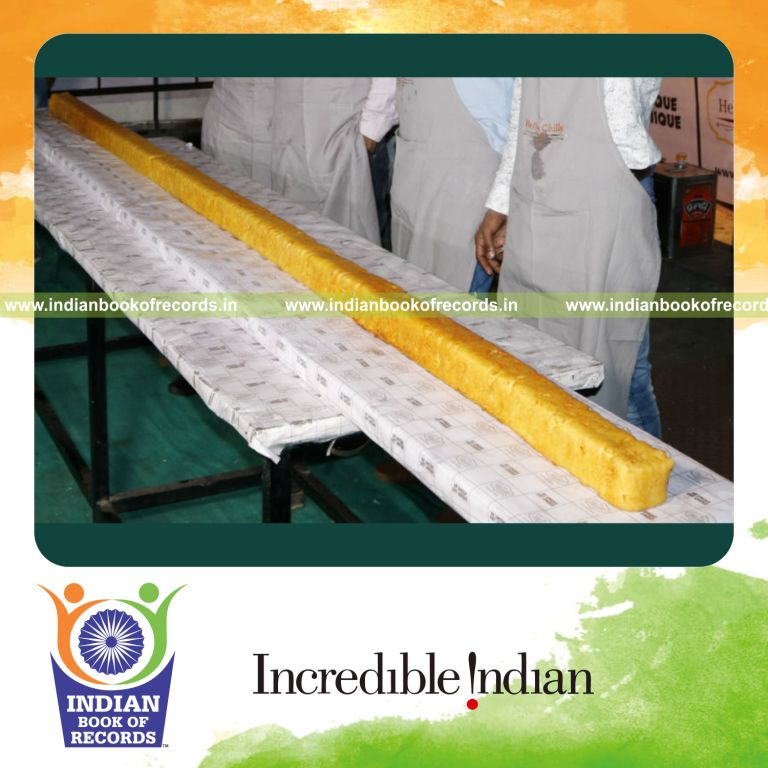a giant molded potato chip shaped like a french fry created as a food display for a record in Indian Book of Records