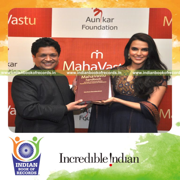 male individual creating large and expensive vastu book for record in Indian Book of Records