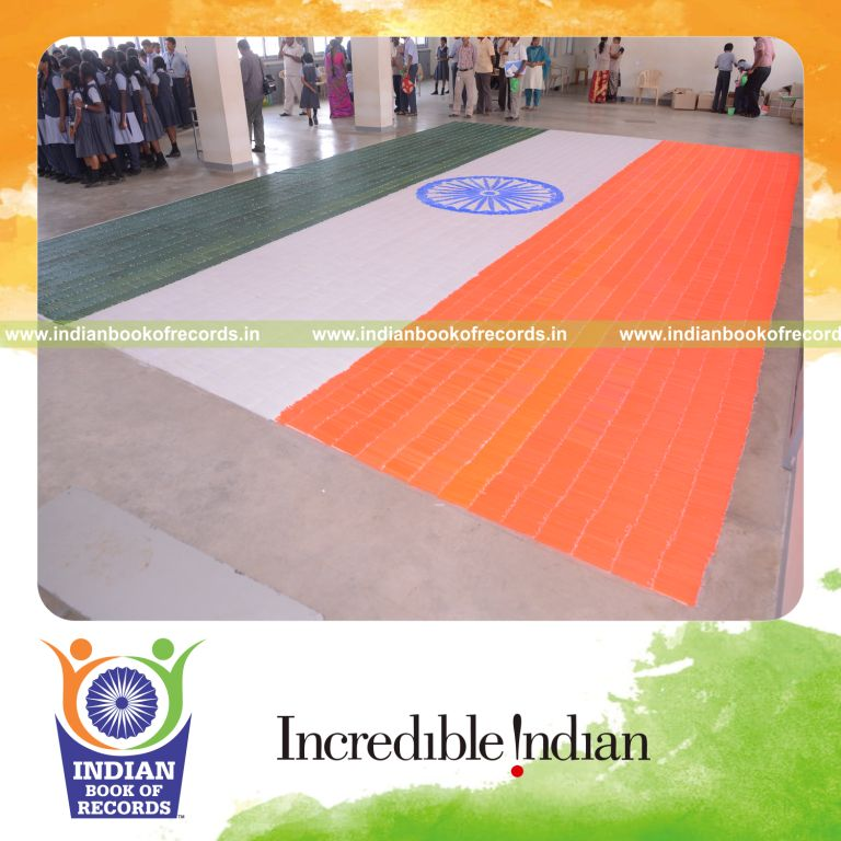 young girl creating national flag using candles for Indian Book of Records