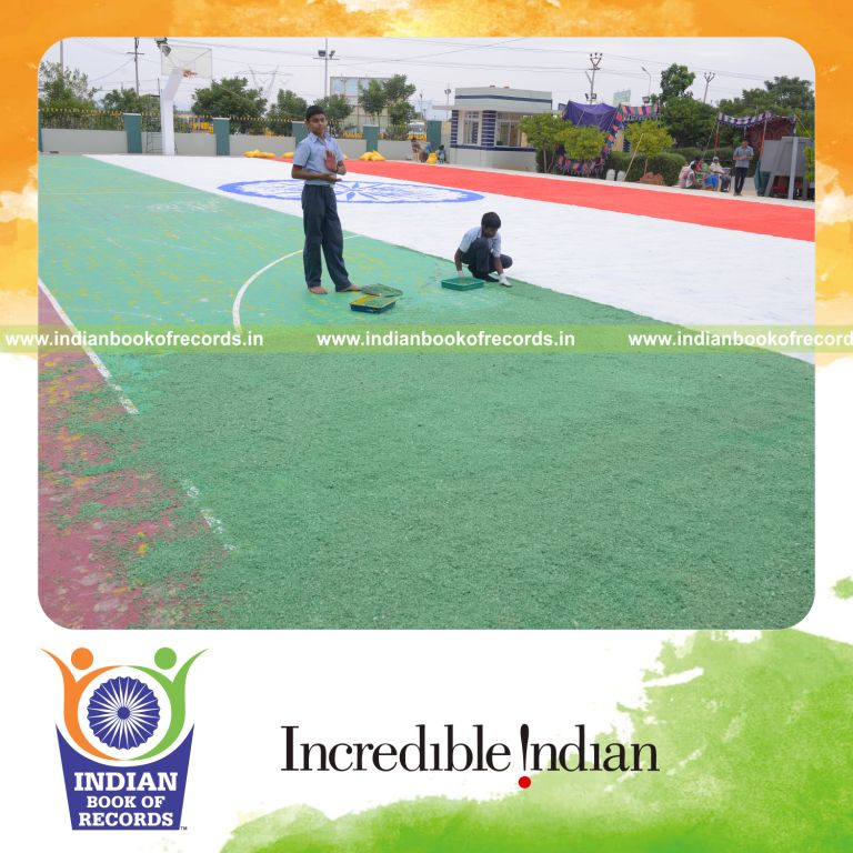 young boy creating national flag using salt for Indian Book of Records