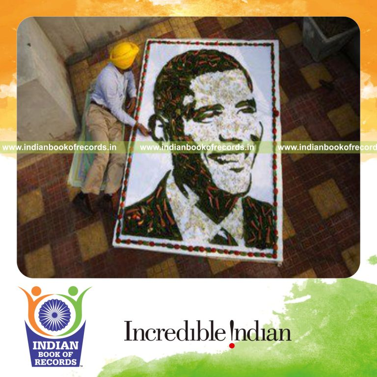 male individual creating obama portrait using vegetables for record in Indian Book of Records
