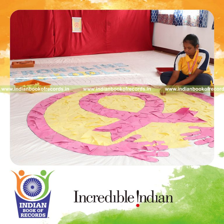 A large mosaic artwork created using origami fish designs displayed for Indian Book of Records
