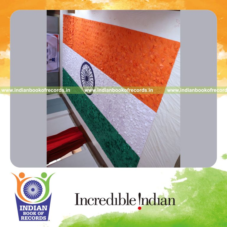 A large national flag creatively formed using origami hearts displayed for Indian Book of Records
