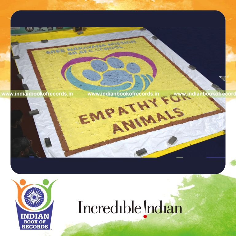 Visual mosaic created using numerous origami hearts forming a large design for Indian Book of Records