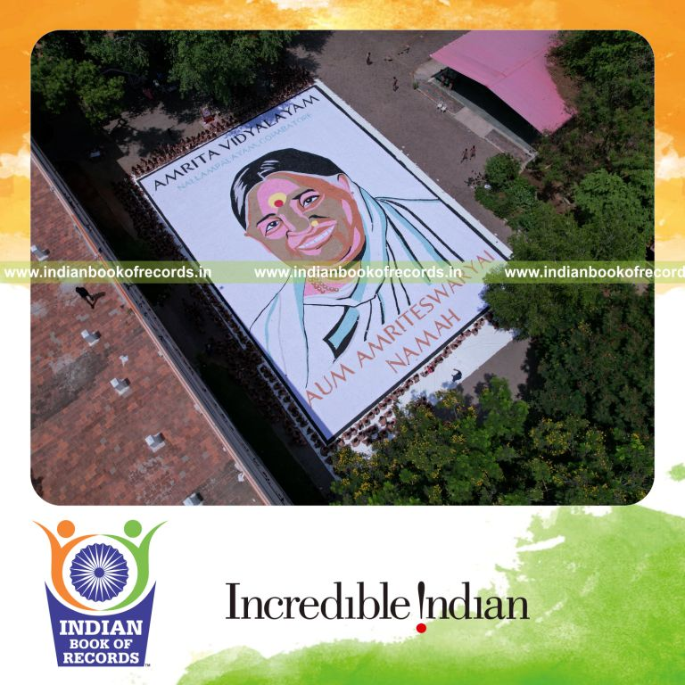 A large portrait artwork created using origami hearts by a team displayed for Indian Book of Records