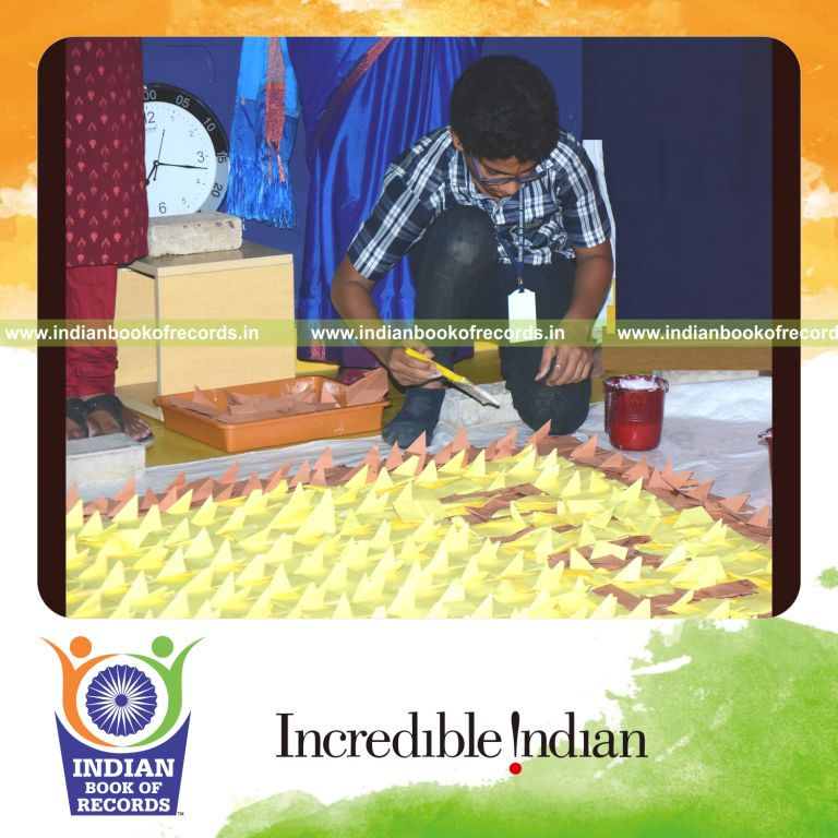Large-scale mosaic made of origami houses arranged creatively into one artwork for Indian Book of Records