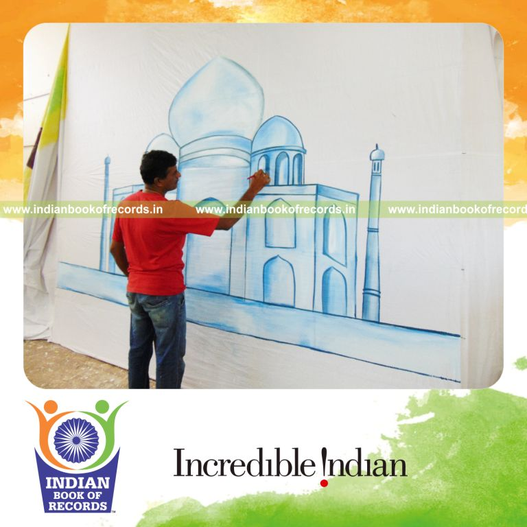 individual male creating largest painting artwork for Indian Book of Records