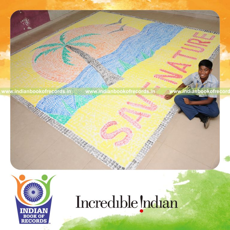 young male creating large painting using cotton for record in Indian Book of Records