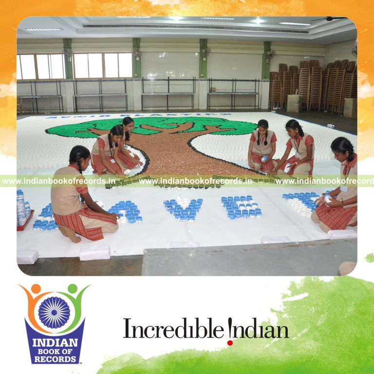 team creating large mosaic using paper cups for record in Indian Book of Records