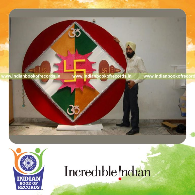 male individual creating a large paper rakhi for record in Indian Book of Records