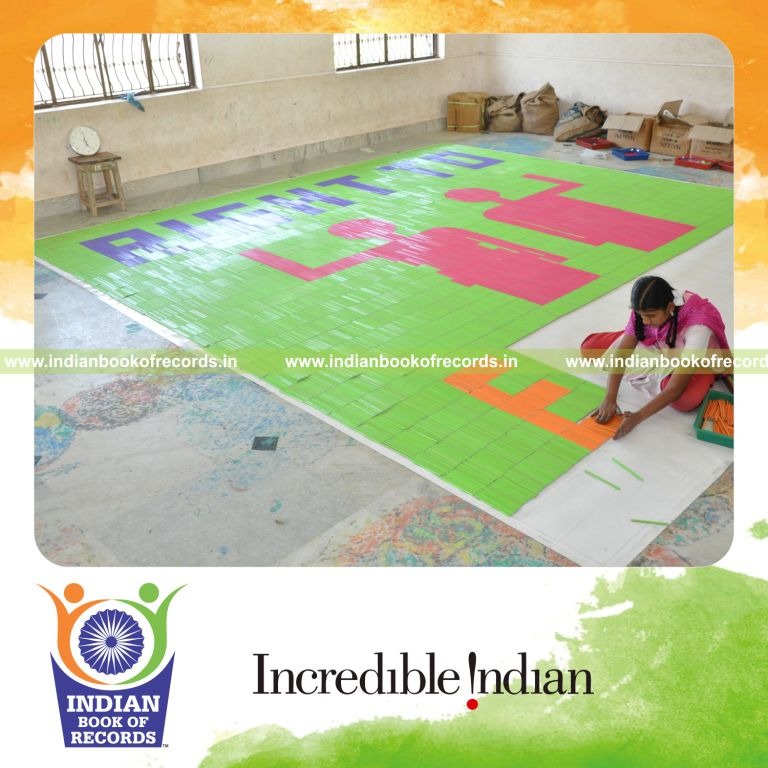 young female creating large mosaic using pencils for record in Indian Book of Records