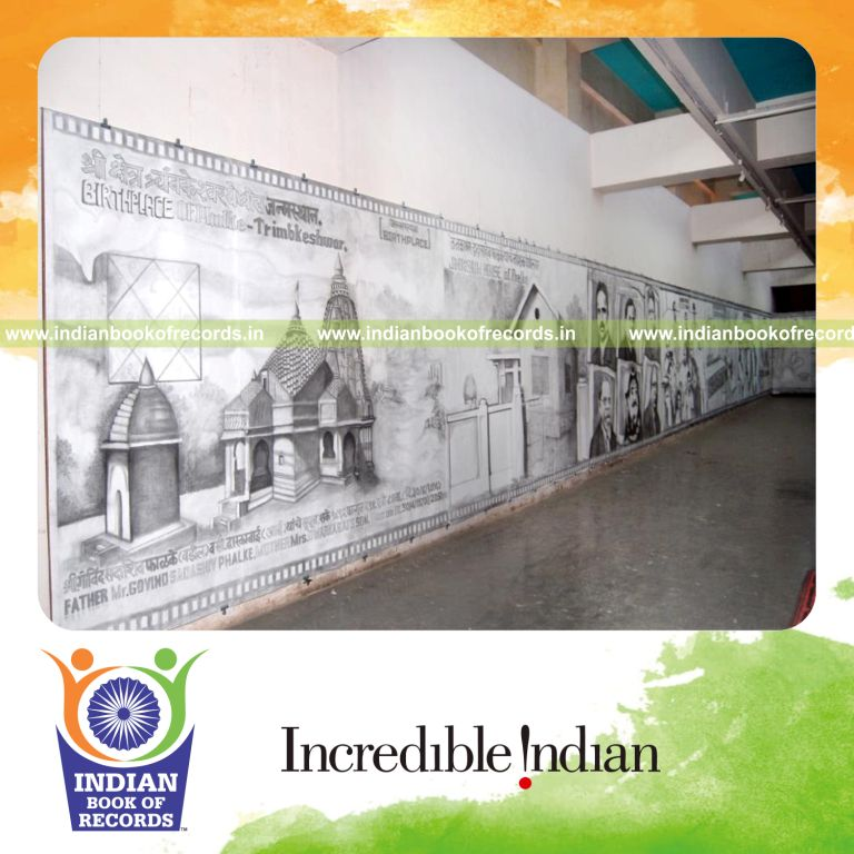 male artist creating a large pencil sketch for record achievement in Indian Book of Records