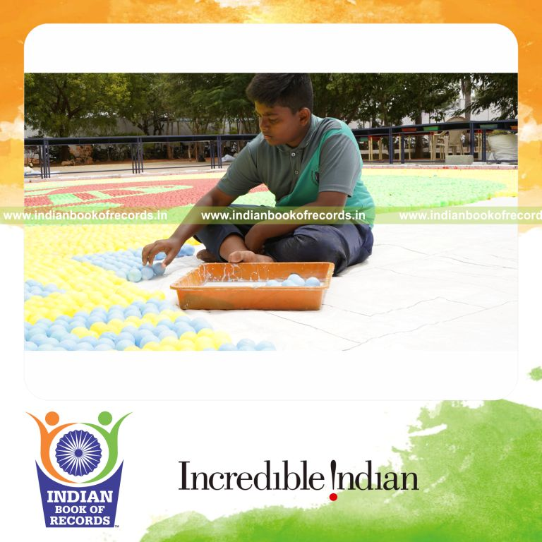 A colorful mosaic made with plastic balls arranged in a large pattern recognized by Indian Book of Records