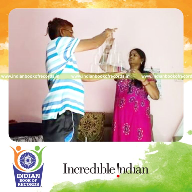 largest triangle made of stacked plastic cups for record in Indian Book of Records