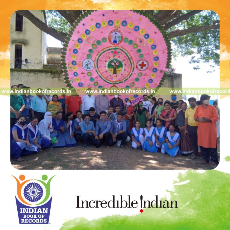 Huge rakhi tied around a tree as part of a cultural display recognized by Indian Book of Records