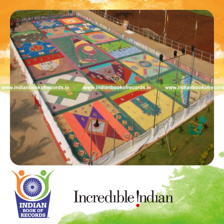 female individual creating rangoli using waste materials for record in Indian Book of Records