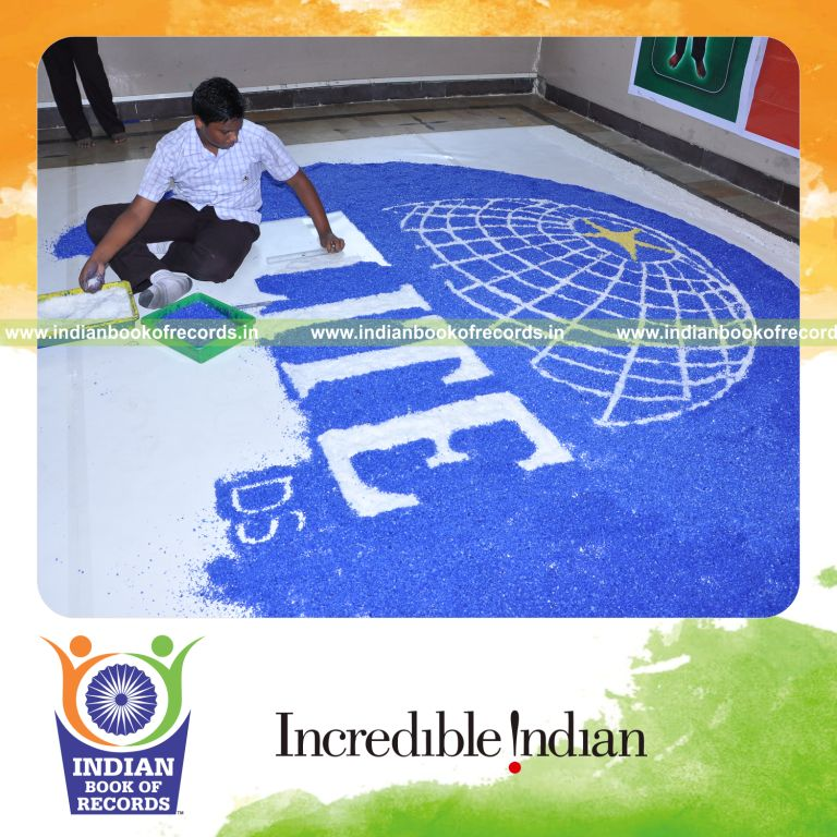 young male creating large mosaic using salt for record in Indian Book of Records