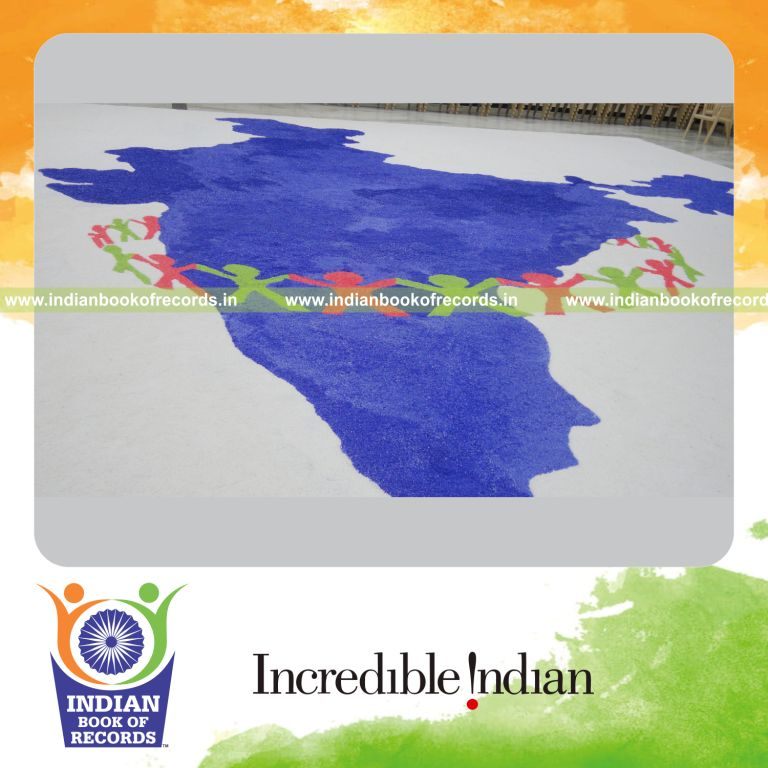 team creating a large mosaic artwork using salt for record in Indian Book of Records