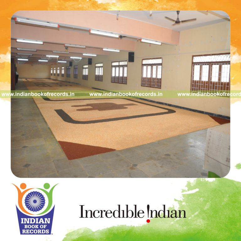 team creating large mosaic artwork using seeds for record in Indian Book of Records