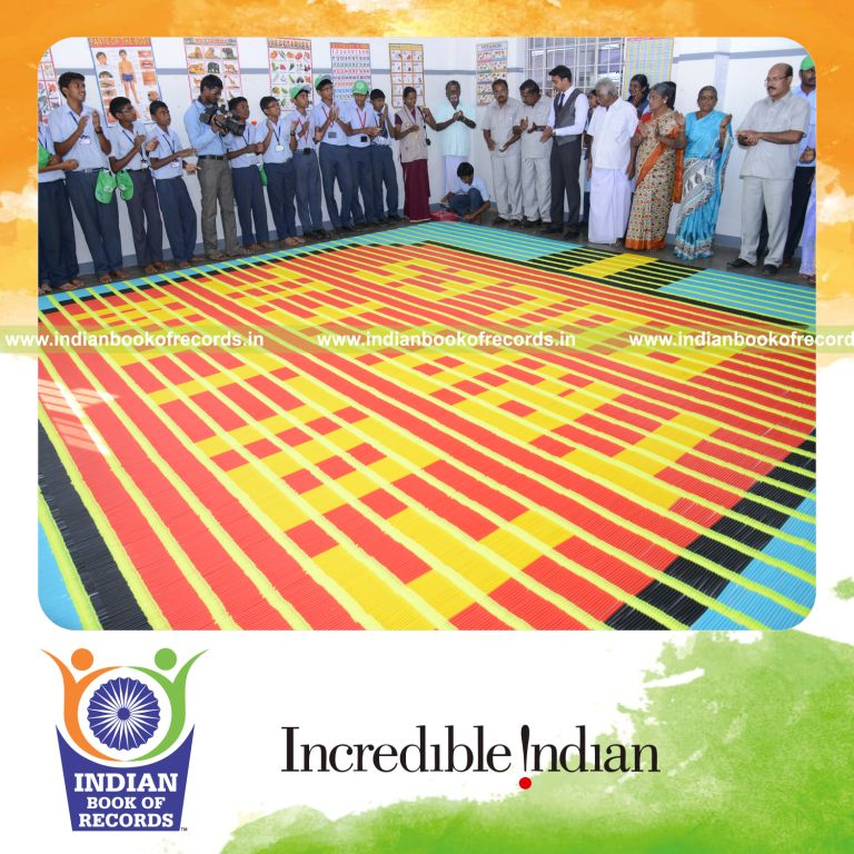young boy creating mosaic using sketch pens for Indian Book of Records