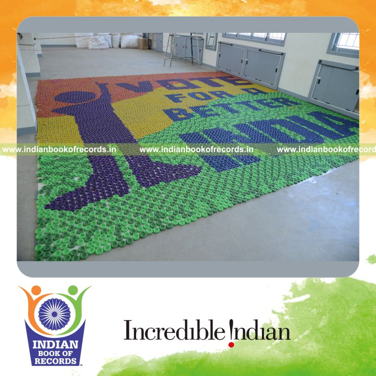 young boy creating mosaic using spin wheels for Indian Book of Records