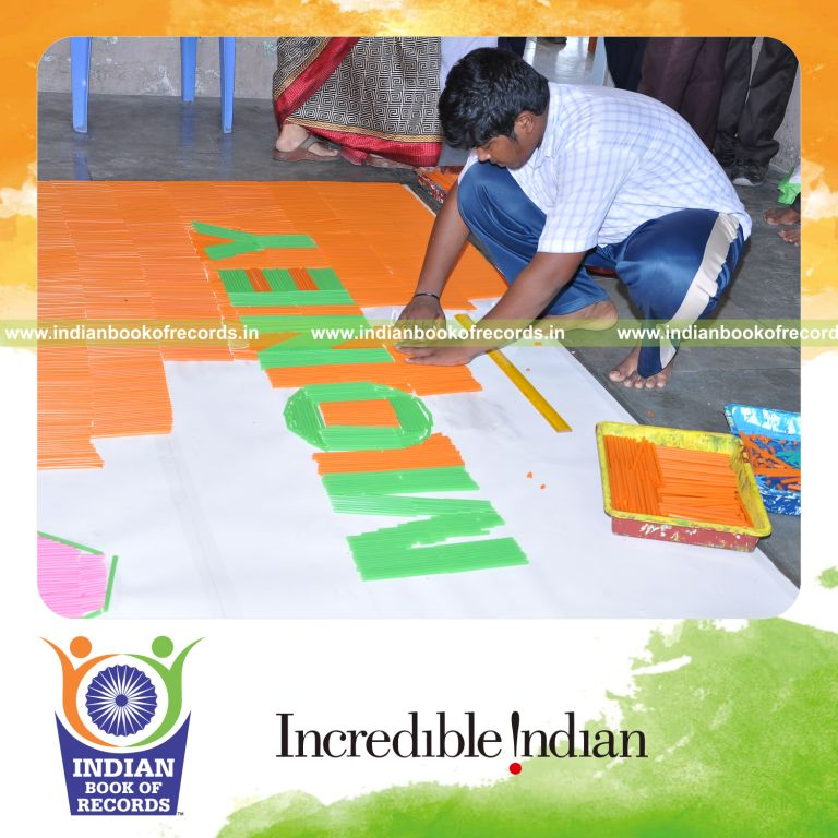 young male creating large mosaic using straws for record in Indian Book of Records