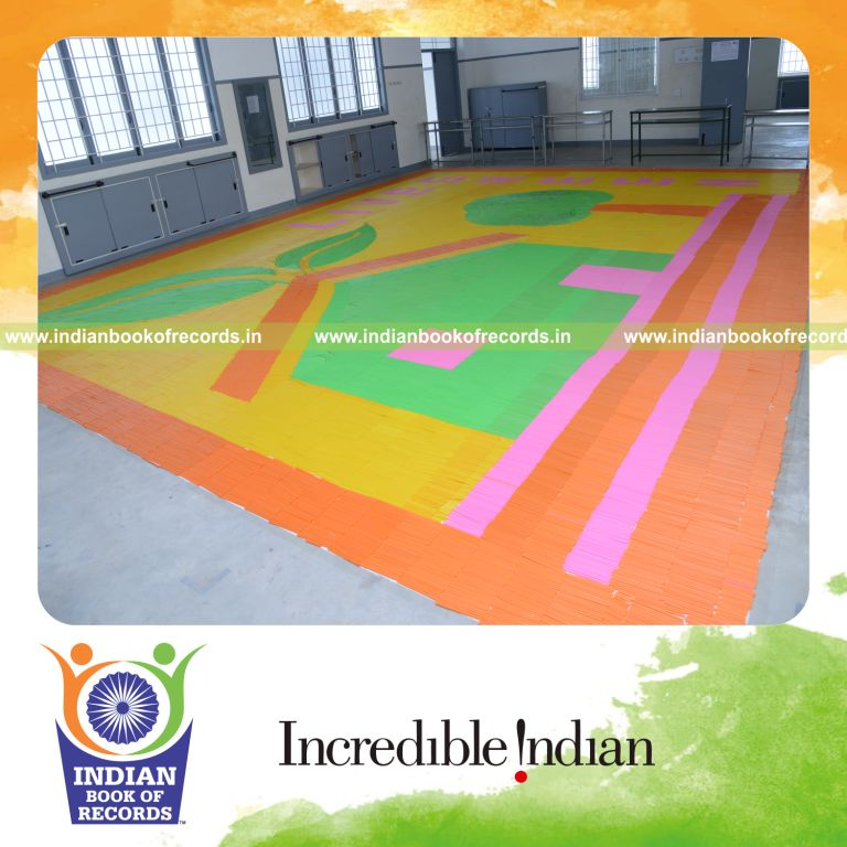 young boy creating mosaic using straws for Indian Book of Records