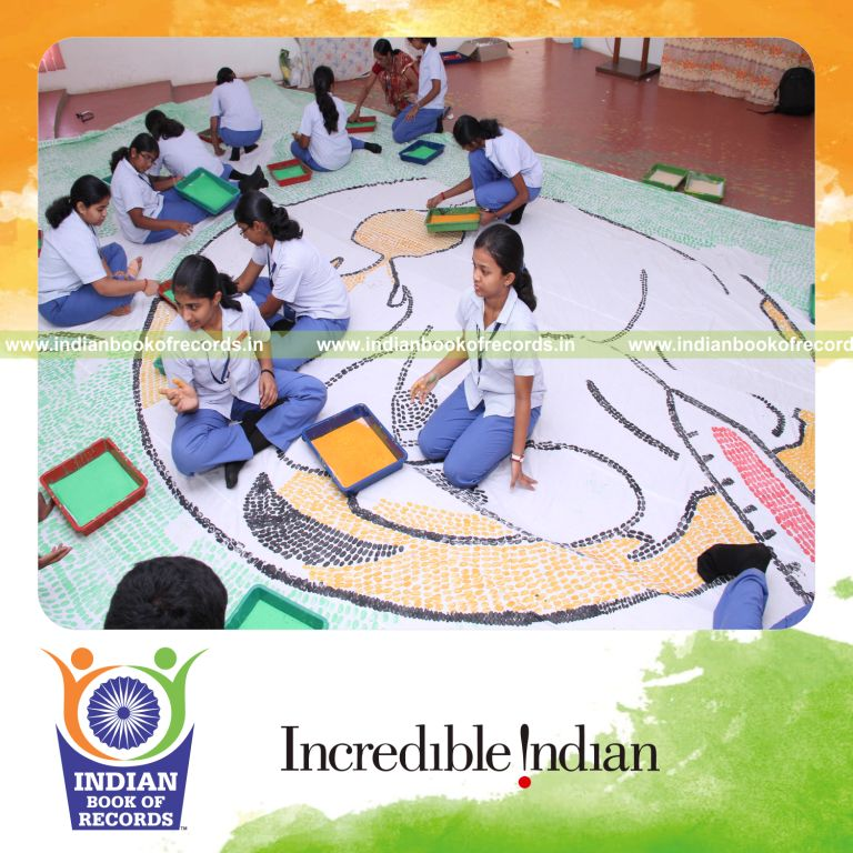 team creating large thumbprint painting for record in Indian Book of Records