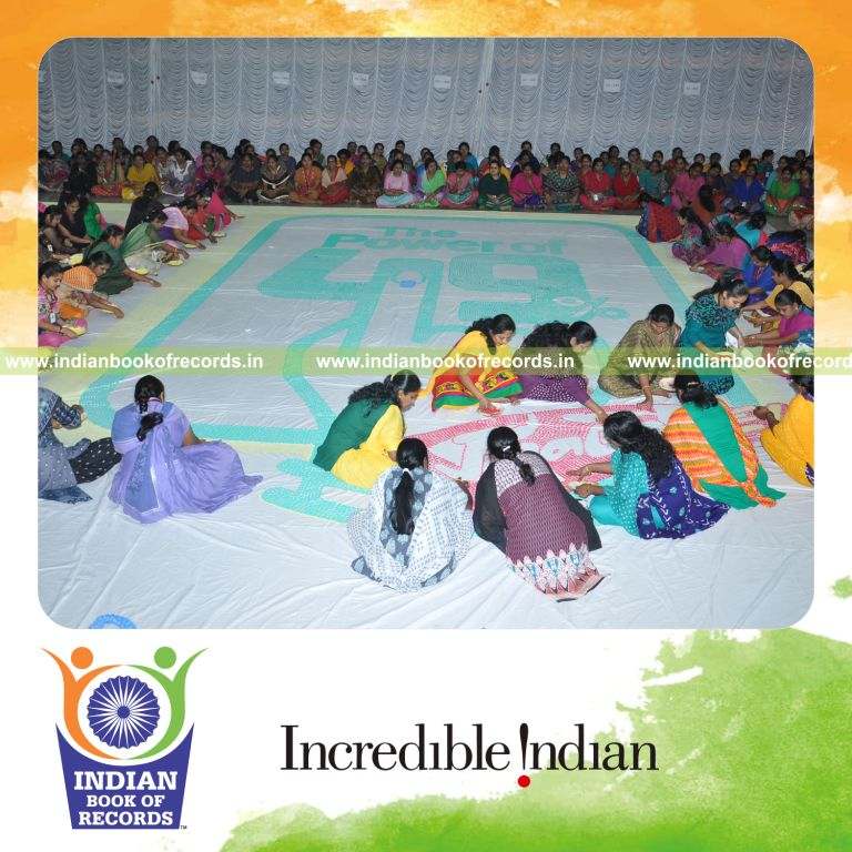 team creating large thumbprint painting for Indian Book of Records