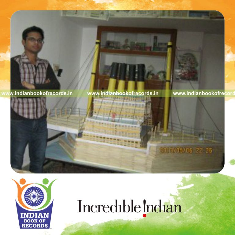 male individual creating titanic ship model using ice cream sticks for record in Indian Book of Records