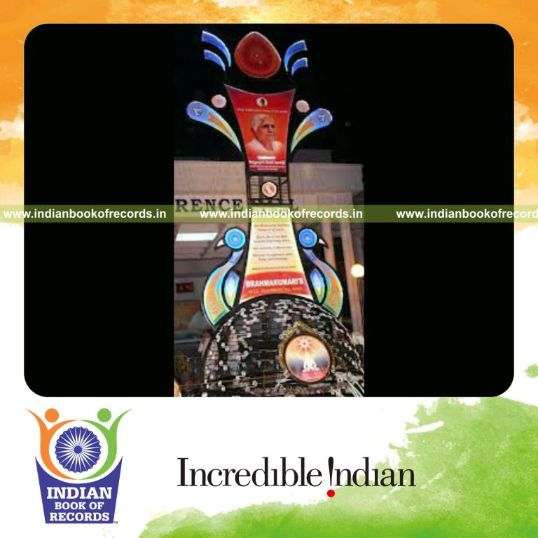male individual creating large trophy for record in Indian Book of Records