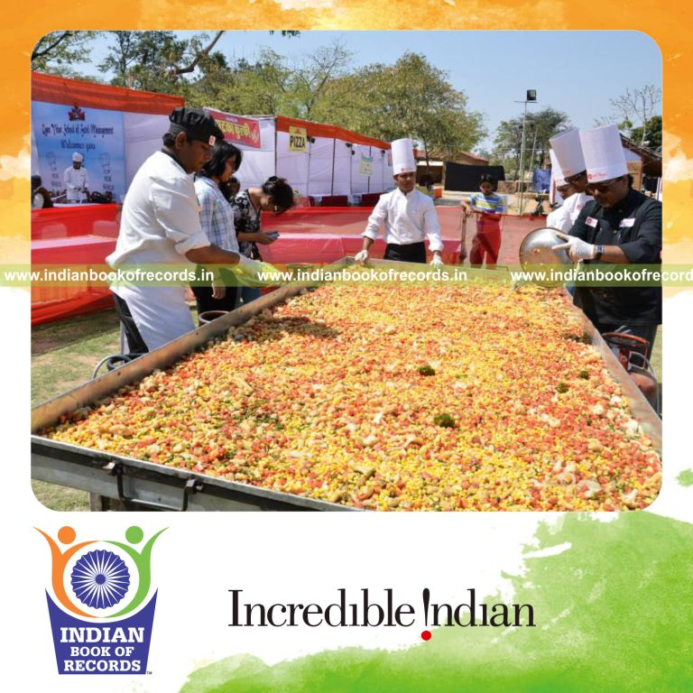 team preparing large vegetable dish for Indian Book of Records