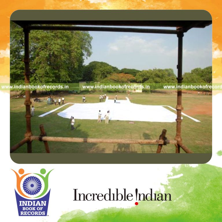team creating a large white apron for record achievement in Indian Book of Records