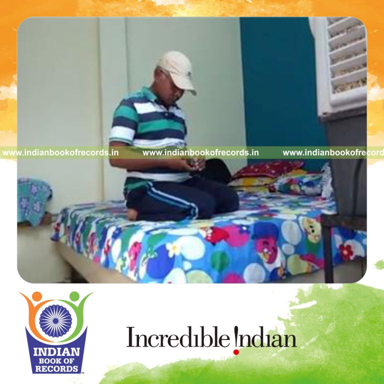 individual balancing aa battery on index finger for longest time for record in Indian Book of Records