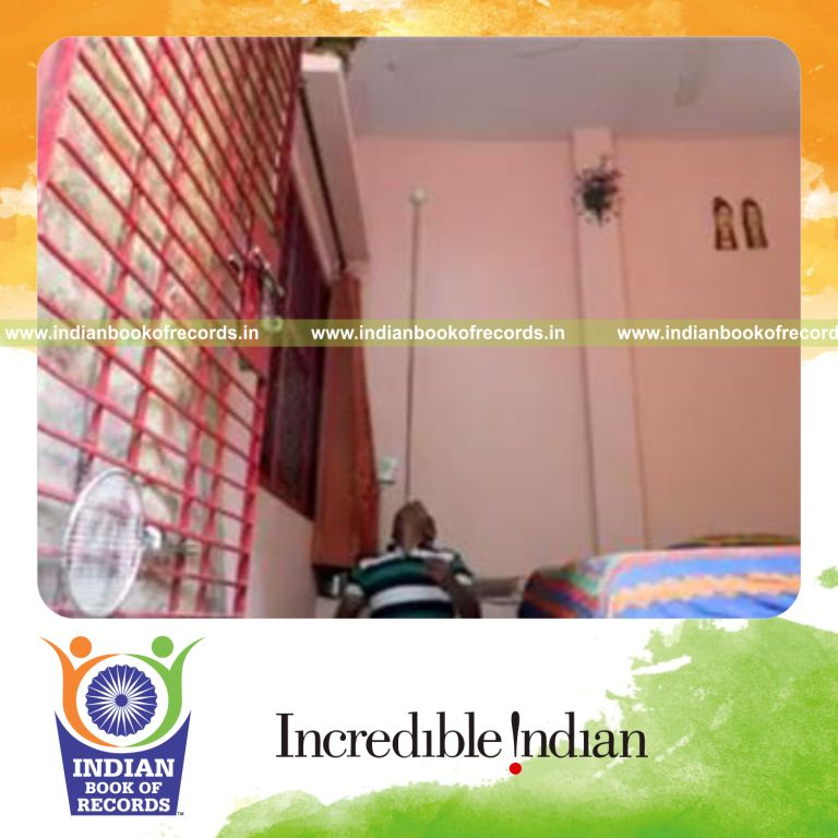 individual balancing baseball on pool cue on chin for record in Indian Book of Records