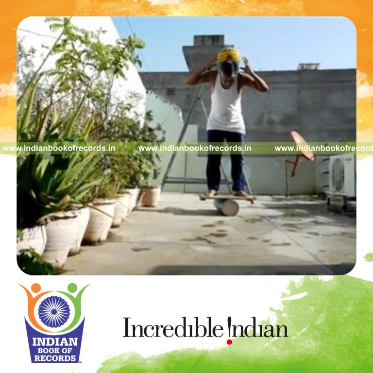 individual holding basketball in neck trap while balancing on rola bola for record in Indian Book of Records