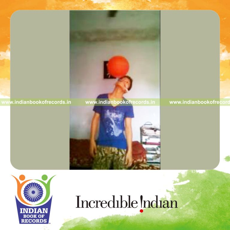 individual spinning basketball on toothbrush held in mouth for record in Indian Book of Records