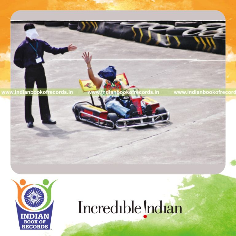male individual performing karting while blindfolded for extended duration for record in Indian Book of Records