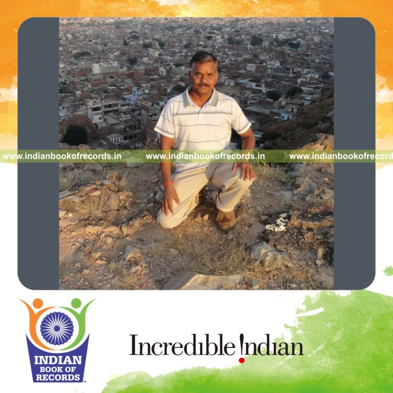 individual holding yoga boat pose on balancing board for Indian Book of Records